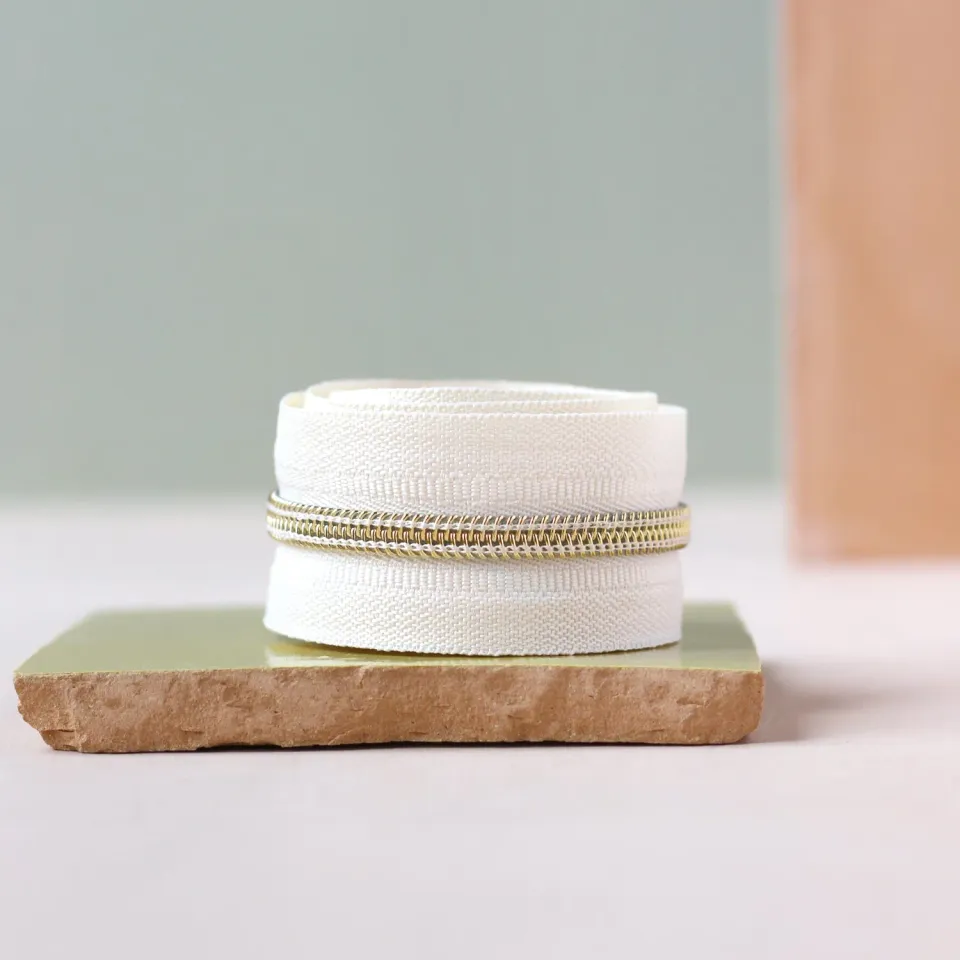 La Maison Naïve fermeture éclair blanc cassé doré au mètre