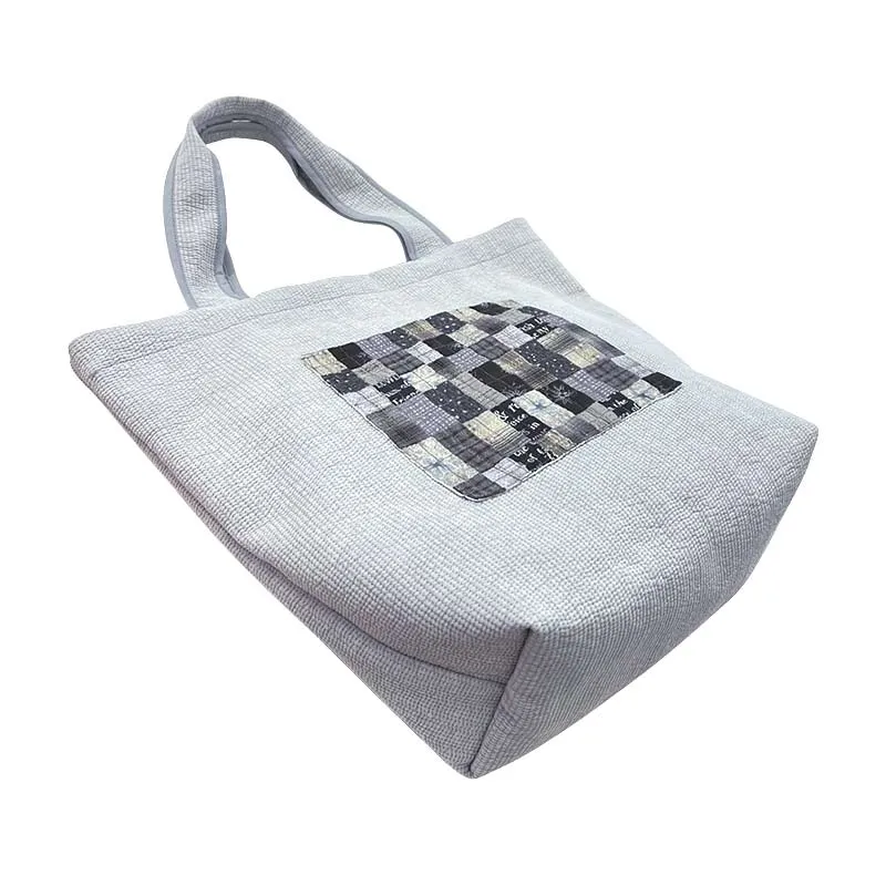 Yoko Saito Nubi kit tote bag matelassé gris à poche
