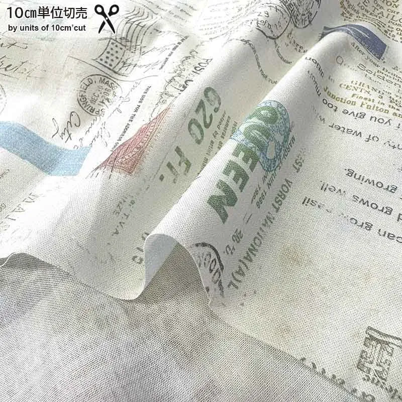 Yoko Saito 2026-06-A03 tissu coton écru au mètre timbres