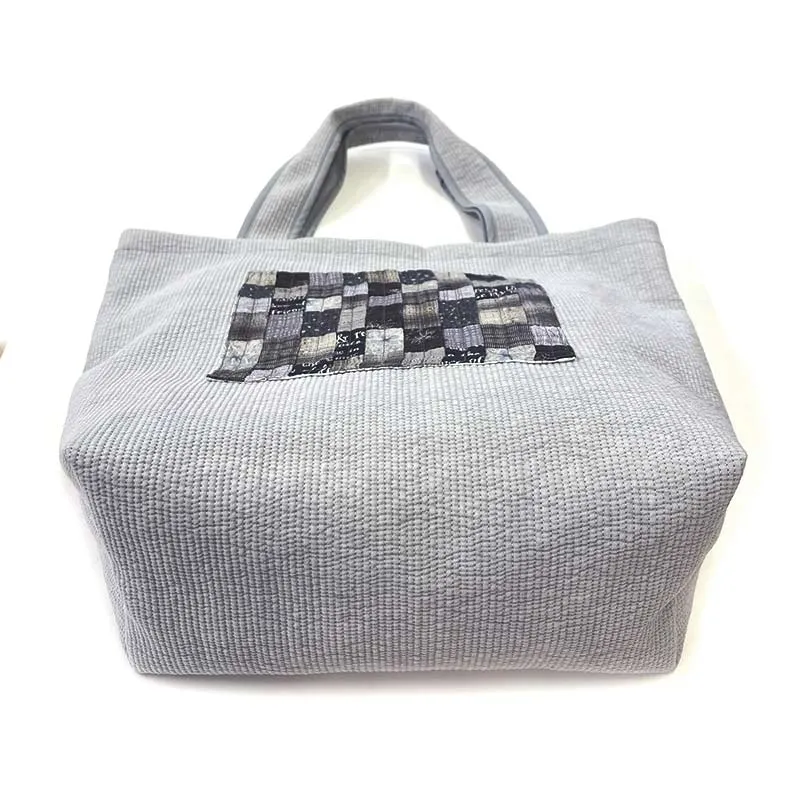 Yoko Saito Nubi kit tote bag matelassé gris à poche